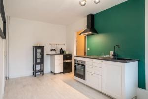 Kuchyňa alebo kuchynka v ubytovaní Appartement Cosy Art Déco/ Proche centre-ville
