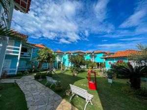 a view of the courtyard of a resort at Pousada Paraíso do Atlântico in Arraial do Cabo +33 photos