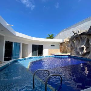 a swimming pool in the middle of a house at CASA PALMA CARTAGENA in Cartagena de Indias