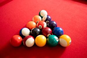 a group of pool balls on a pool table at The Grand Barn in York