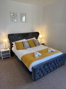 a bedroom with a large bed with towels on it at 23 Horner Street York in York