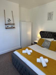a bedroom with a large bed with towels on it at 23 Horner Street York in York