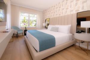 Ένα ή περισσότερα κρεβάτια σε δωμάτιο στο Avalon Hotel