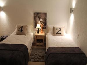 מיטה או מיטות בחדר ב-Appartement La Clusaz, 4 pièces, 8 personnes - FR-1-459-6