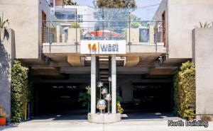 a building with a sign in front of a garage at 14 West Laguna Beach in Laguna Beach