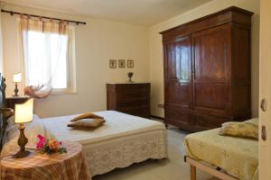 Postel nebo postele na pokoji v ubytování Agriturismo Borgo Vigna Vecchia