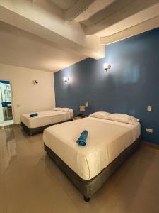 Cama ou camas em um quarto em Casa Las Palmas Hotel Boutique