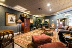 a living room with a couch and a table at Grand Vista Hotel Grand Junction in Grand Junction