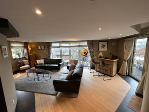 a living room with a couch and a table at Livremont7 in Malmedy