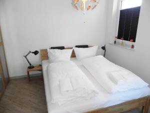 Postel nebo postele na pokoji v ubytování Villa Bettina - Ferienwohnung 07