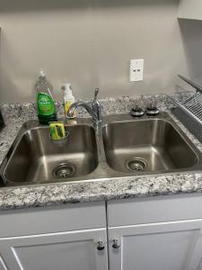 a stainless steel sink in a kitchen at Wonderful 2-bedroom apartment in Camrose