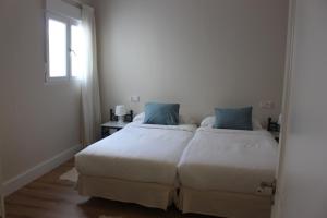 Postel nebo postele na pokoji v ubytování La Casona de Galdós