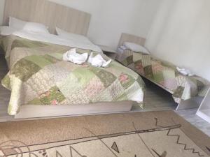 Ein Bett oder Betten in einem Zimmer der Unterkunft Пансионат "Скиф-Мурок"