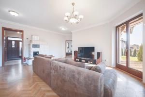 Televízia a/alebo spoločenská miestnosť v ubytovaní Panorama Buda