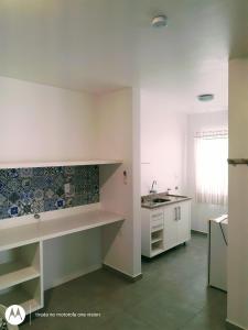 a kitchen with a sink and a counter top at Espaço Herlang in Blumenau +181 photos