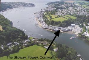 an aerial view of a river with a black arrow at The Slipway Fowey Harbour Parking 1 Min & Garden in Fowey