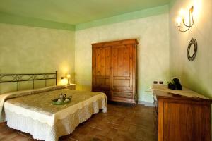 Postel nebo postele na pokoji v ubytování Agriturismo Borgo Vigna Vecchia