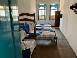 Postel nebo postele na pokoji v ubytování Pousada e Camping Lumiar