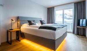 Postel nebo postele na pokoji v ubytování Hotel Residenz Hochalm - Joker Card Partner