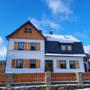 a house with a fence in front of it at Pension MAX in Pernink