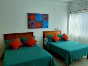 Postel nebo postele na pokoji v ubytování Hotel La Estrella Polar