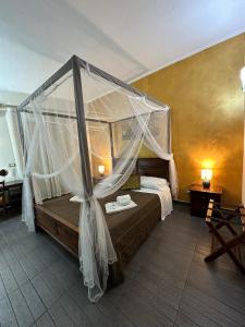 En eller flere senge i et værelse på Etna Rooms