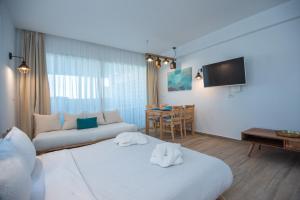 Posteľ alebo postele v izbe v ubytovaní Ammos Lux Apartments Crete