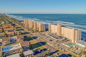 an aerial view of the beach and buildings at Southpoint #703 in Ponce Inlet