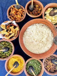 a group of bowls of food on a table at Sky Retreat - Sri Lanka in Gampaha