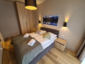 Posteľ alebo postele v izbe v ubytovaní Apartament D2 Karpatia - 5D Apartamenty