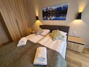 Posteľ alebo postele v izbe v ubytovaní Apartament D2 Karpatia - 5D Apartamenty