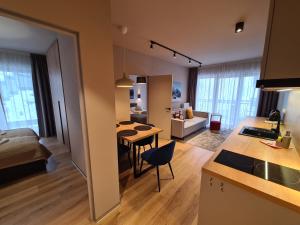 Posteľ alebo postele v izbe v ubytovaní Apartament D2 Karpatia - 5D Apartamenty