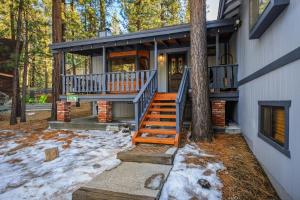 a house with a staircase leading up to a house at Serenity Summit Cabin in Big Bear Lake