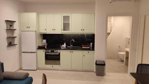 Kuchyň nebo kuchyňský kout v ubytování Aelia Mare Apartments Nr2