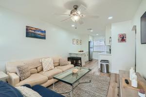 a living room with a couch and a table at Hidden Oasis ** Stunning 2 BR ** Sunset Shores in West Palm Beach