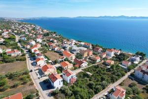 an aerial view of a town next to the water at Apartment Mare Blu in Kožino