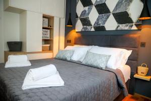 a bedroom with a bed with two pillows on it at Apartment Mare Blu in Kožino