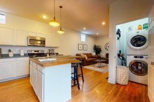 a kitchen and living room with a washer and dryer at Private Home-Backyard-Parking Near Nulu Downtown in Louisville