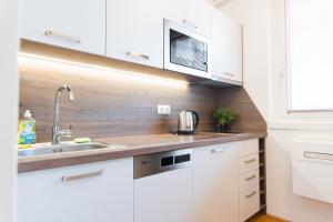 Kuchyň nebo kuchyňský kout v ubytování Hotel Triester