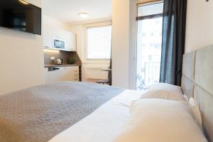 Postel nebo postele na pokoji v ubytování Hotel Triester