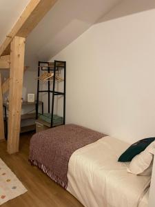 Postel nebo postele na pokoji v ubytování Gîte l'Eden à l'Est