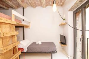 Posteľ alebo postele v izbe v ubytovaní Apartamento Tr Auriga en el Barri Vell Girona