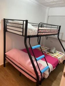 a bunk bed with two bunk beds in a room at Apartamento con vistas al mar in Puerto de Mazarrón +6 photos