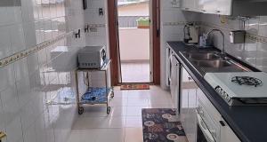 A kitchen or kitchenette at B&b Binario38