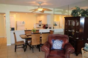 a kitchen and dining room with a table and chairs at Tranquility by the Beach in Key West
