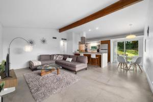 a living room with a couch and a table at Quiet Haven with Huge Fenced Yard Fast Internet by Lodgewell in Austin