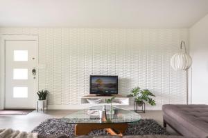a living room with a couch and a coffee table at Quiet Haven with Huge Fenced Yard Fast Internet by Lodgewell in Austin