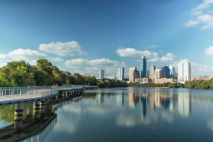 a view of a river with a city in the background at Quiet Haven with Huge Fenced Yard Fast Internet by Lodgewell in Austin