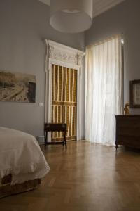 Postel nebo postele na pokoji v ubytování Palazzo Bellini