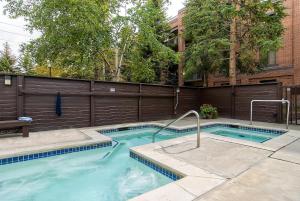 a swimming pool in front of a building at PARK STATION 113 condo in Park City